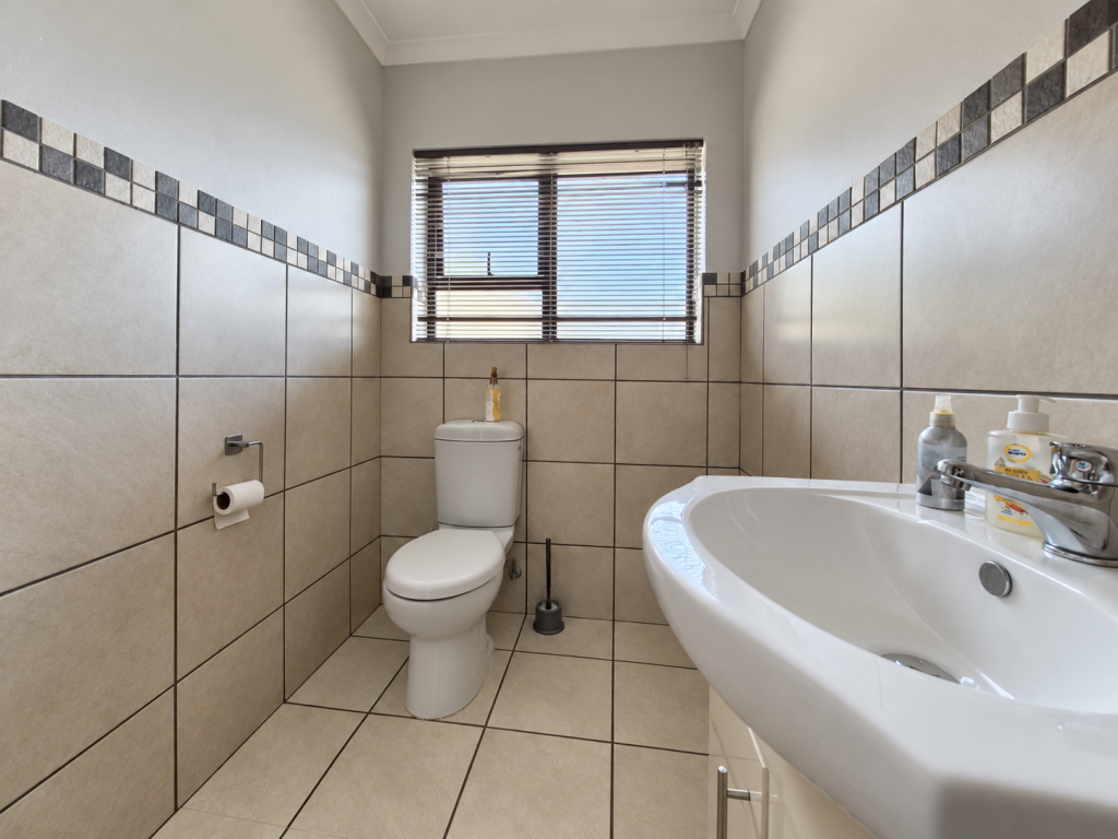 Bright Minimalist Bathroom with Mosaic Accents