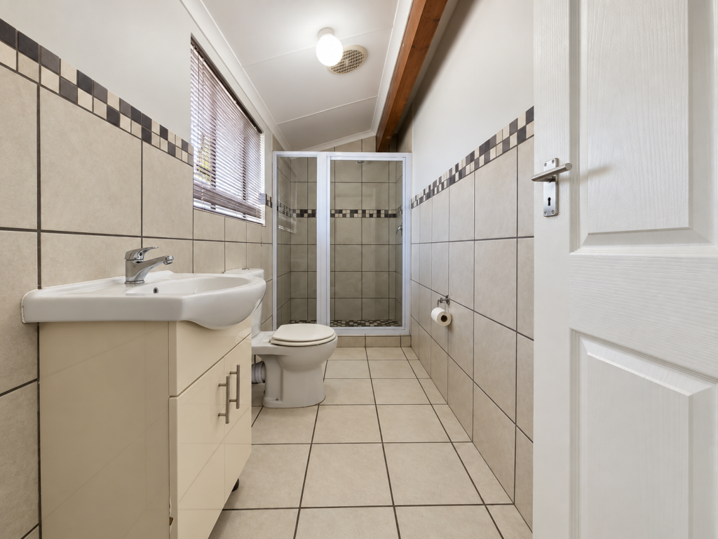 Bright Neutral Tiled Bathroom Interior