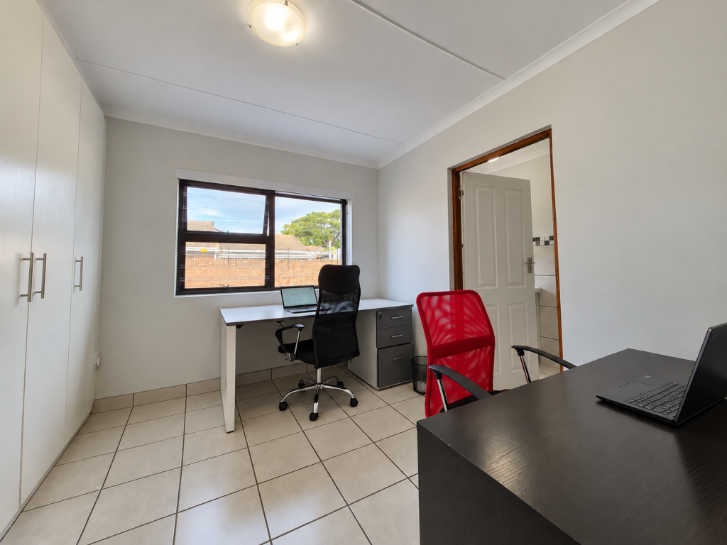 Minimalist Home Office with Red Chair
