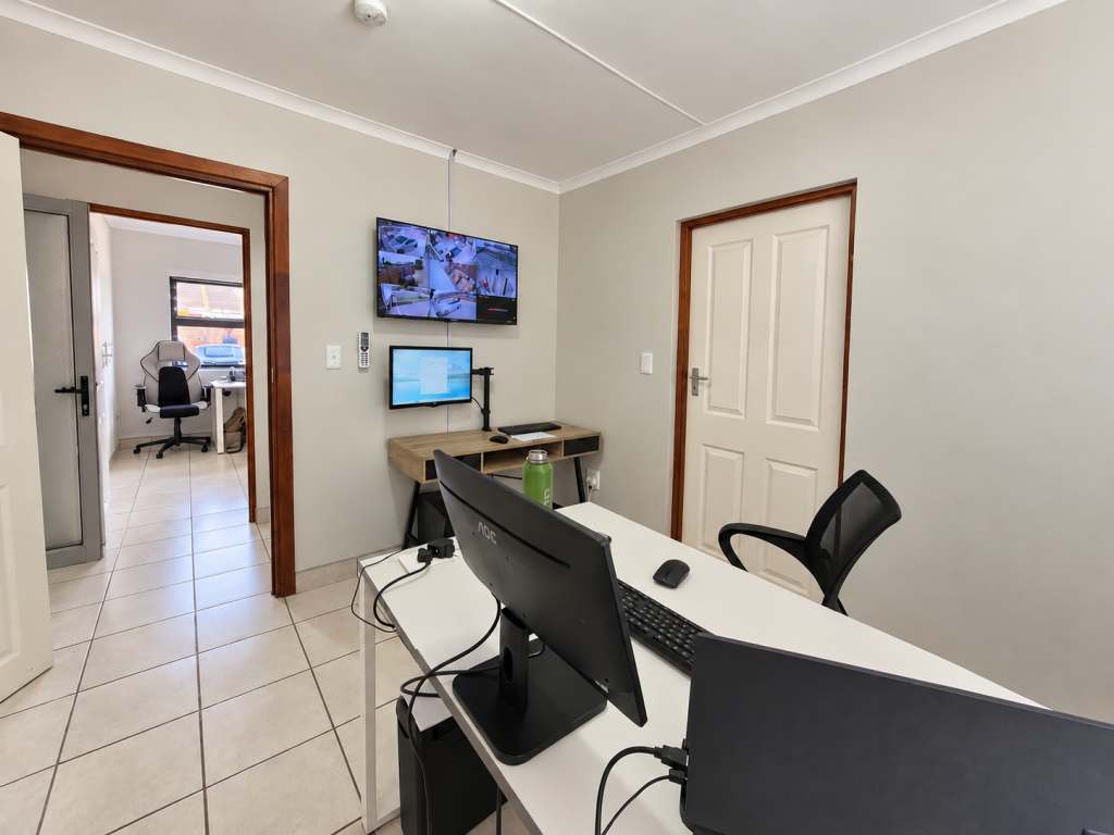 Modern Home Office with Security Monitors
